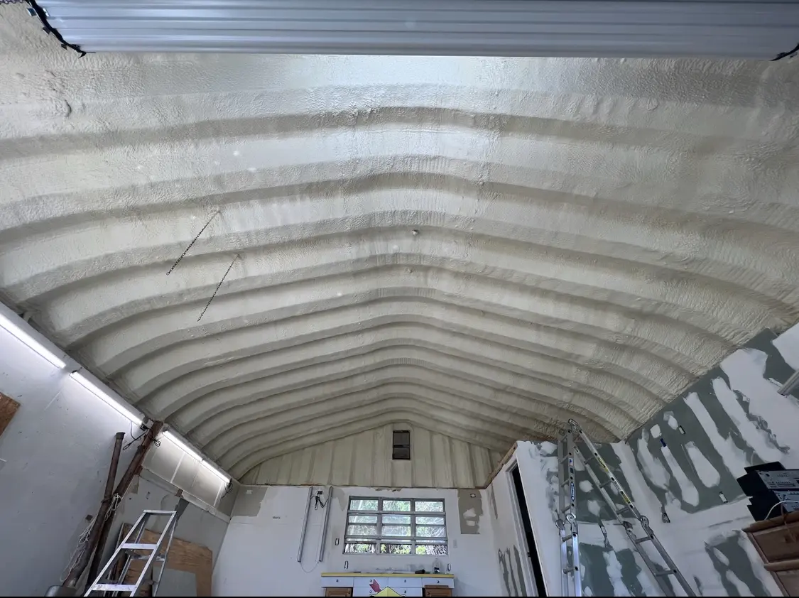 Spray polyurethane foam applied to the underside of a metal roof deck in Dubuque